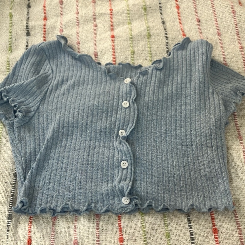 I am selling a light blue cropped t-shirt